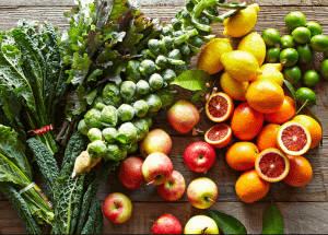 a group of fruits and vegetables on a wood surface Healthy Weight Loss Diets Welwyn Garden City