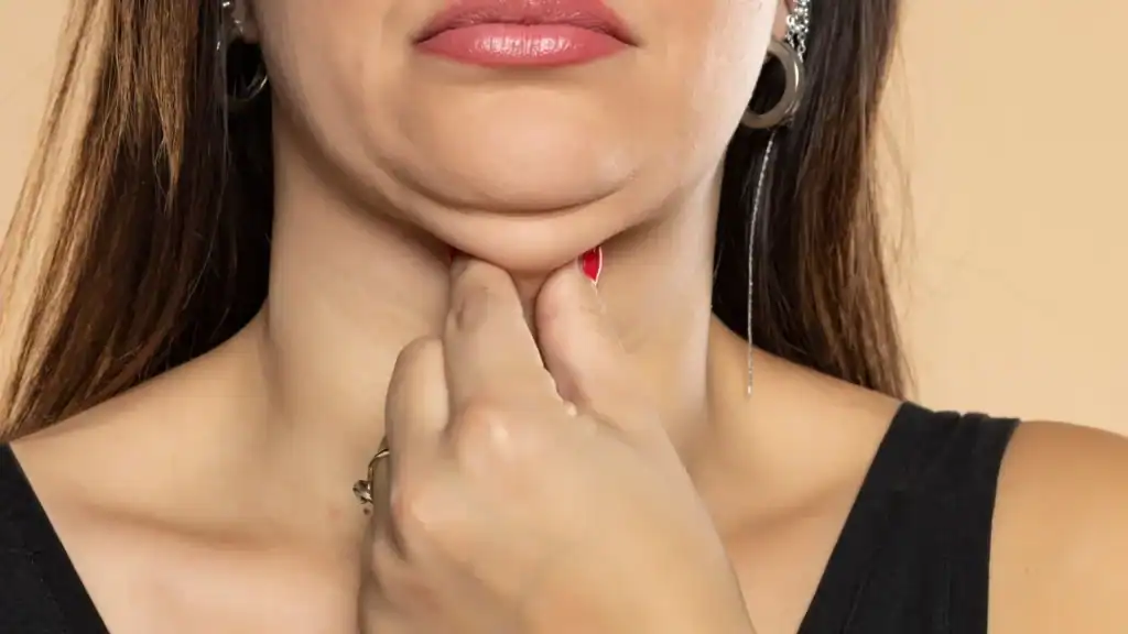 An image of a woman with double chin, sad, worried : Non Surgical Double Chin Removal Treatment in Welwyn Garden City, UK
